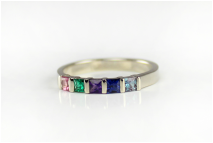 custom-designed mother's ring, princess-cut birthstones, genuine gemstones, bar-set contemporary ring, tourmaline, emerald, amethyst, sapphire, alexandrite