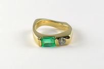 custom-designed 18-karat gold ring, recycled emerald and diamond, twisted square solid shank, flushset diamond