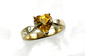 heart-shaped citrine, traditional ring with prongs, flushset diamonds scattered in 14-karat yellow gold ring